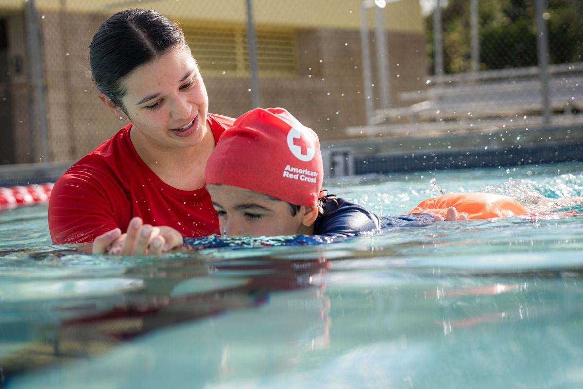 May 4, 2024. Miami, Florida.
This photograph illustrates a Water Safety Instructor® teaching swimming and water safety skills that are part of an American Red Cross Learn-to-Swim class delivered by a Red Cross training provider.

Fiorenza Bagala is a Water Safety Instructor® and lifeguard and enjoys sharing her love of swimming with children at the Palm Springs North Pool in Miami, Florida. She emphasized the importance of this training:  People really don't understand how dangerous water can be. But at the same time, it is a great gift. So, people really need to understand how to balance that. 
Photo illustration by The American National Red Cross

Please note: these are staged photos and shouldn t be conveyed as a real event.

